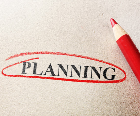 The word Planning written on a paper and circled with red pencil