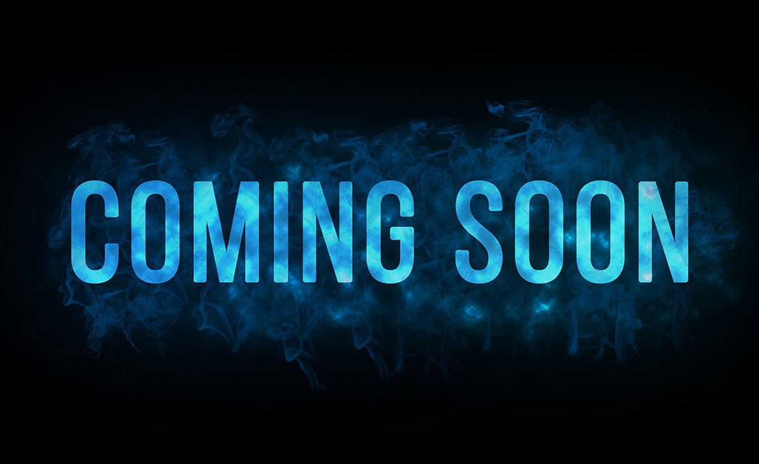 Coming soon text on a blue and black background