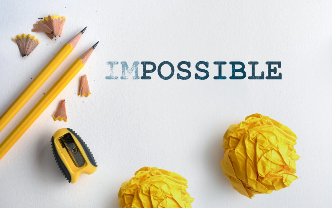 Impossible text with yellow pencil and paper bag next to it